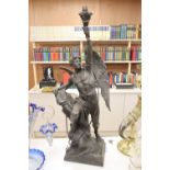 A large bronzed spelter figural lamp, entitled Le Genie Humain, converted to electric, 86cm