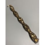 A continental 935 gilt metal and oval and round cut citrine and paste? set bracelet, with