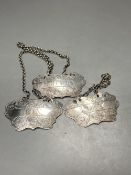 A matched set of three Victorian engraved provincial silver wine labels by William Rawlings Sobey,