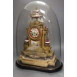 A 19th century French Louis XV style gilt spelter and porcelain mounted eight day mantel clock, on
