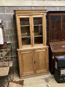 A Victorian pine bookcase, width 104cm depth 47cm height 209cm