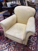 An early 20th century upholstered club armchair