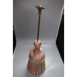 A coloured and carved wood door porter, the brass handle with clenched fist finial, height 71cm