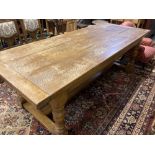 An 18th century style oak refectory dining table, 230 x 93cm height 77cm