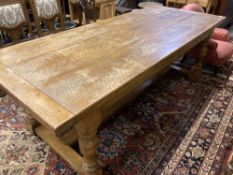 An 18th century style oak refectory dining table, 230 x 93cm height 77cm