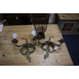 A pair of Louis XV style gilt metal two branch wall lights, and a metal wire framed pricket candle