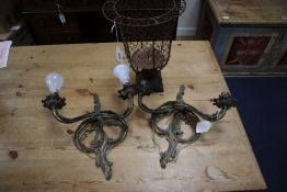 A pair of Louis XV style gilt metal two branch wall lights, and a metal wire framed pricket candle