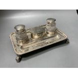 A late Victorian silver rectangular inkstand, with two mounted glass wells and central