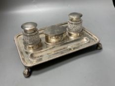 A late Victorian silver rectangular inkstand, with two mounted glass wells and central