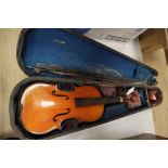 A French 3/4 size violin, Stradivarius label, with bow and accessories, in a case