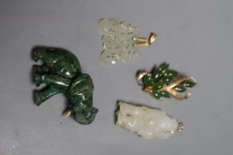 A Chinese pale celadon and russet jade figure of a boy, 4.8cm, a similar carved pendant together