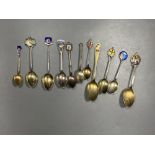 Six 20th century assorted silver and enamel souvenir spoons, gross 81 grams and five similar white
