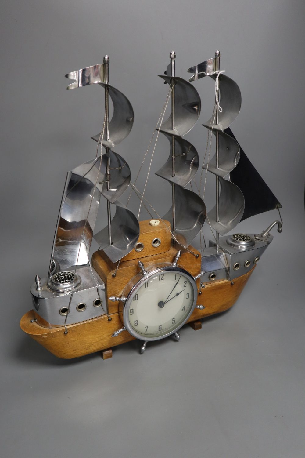 A novelty timepiece in the form a three-masted ship, Metamech Electric movement, 42cm