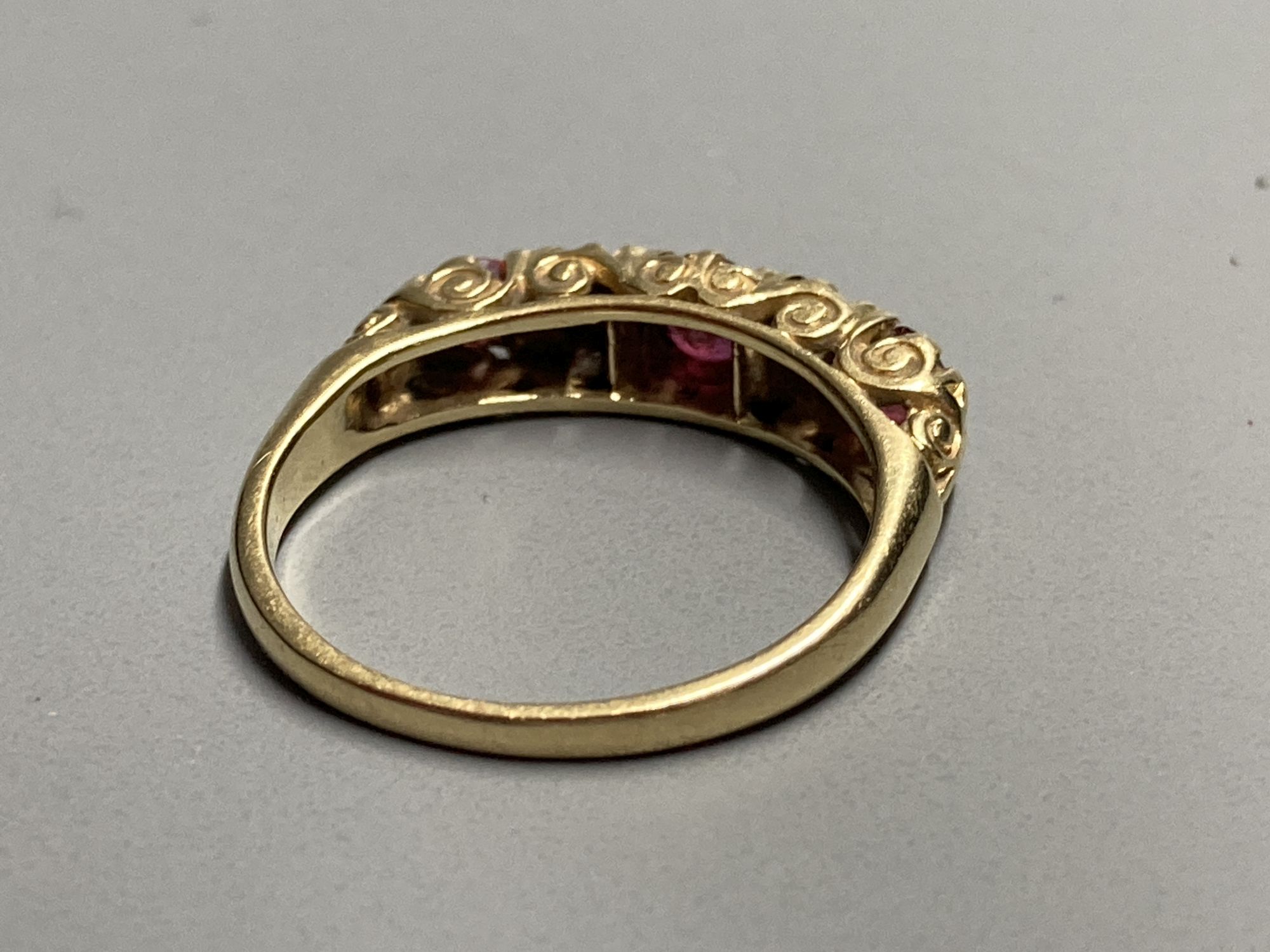 An 18ct Victorian style two stone diamond and three stone ruby set half hoop ring, size K/L. gross - Image 2 of 2