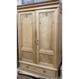 A 19th century French pine two door 'knockdown wardrobe' with drawer and base, width 156cm depth