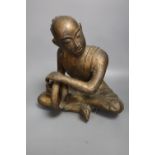 A South East Asian gilt bronze seated figure of a drummer, height 27cm