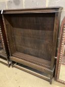 A 1920's oak open fronted bookcase, width 110cm depth 26cm height 141cm