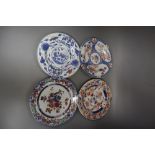 Four 18th century Chinese Imari dishes, 22.5cm, painted underglaze in typical palette