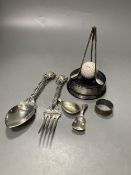 Two 19th century caddy spoons, including one silver and one Dutch white metal, silver napkin ring, a