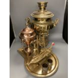 A Russian brass samovar and stand, height 47cm, a copper tea urn, a brass jug and a pair of