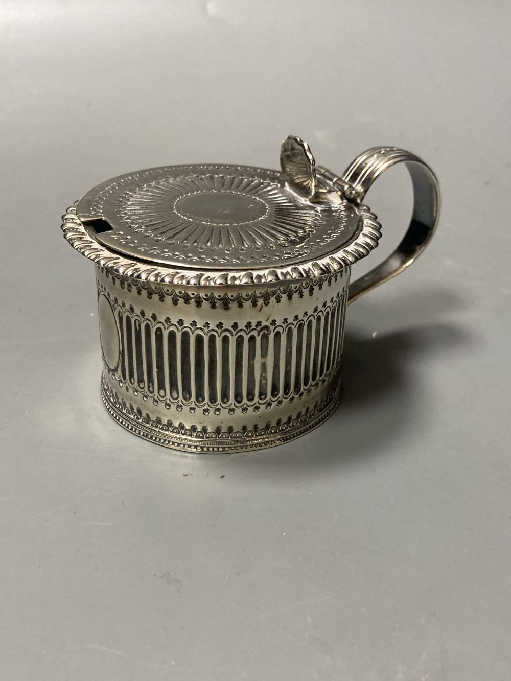 An early George III silver pepperette, with later embossed decoration, Samuel Wood?, London, 1760, - Image 3 of 4