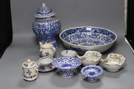 A group of Asian ceramics including a Kangxi blue and white cup and a pair of Chinese enamelled oval