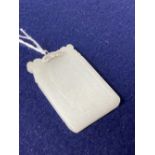 A Chinese diamond set white metal mounted carved white jade pendant, 57mm, gross 35.7 grams.