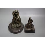 A cast metal sculpture Kiss after Rodin, height 14cm and another of Arabs