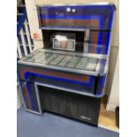 A 1970's Seeburg juke box, width 100cm depth 69cm height 136cm