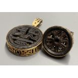 An unusual Chinese pierced gilt metal and base metal inset ring, size P, and matching pendant,
