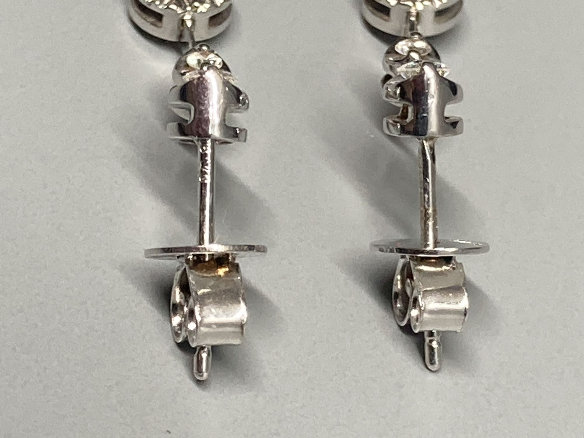 A modern pair of 18ct white gold and illusion set three stone diamond drop earrings, 19mm, gross 2.3 - Image 3 of 3