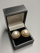 A pair of 20th century yellow metal and mabe pearl earrings, 21mm, one butterfly missing, gross 10.8