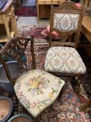 A set of four late Victorian carved oak dining chairs and a pair of Edwardian carved mahogany