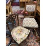 A set of four late Victorian carved oak dining chairs and a pair of Edwardian carved mahogany