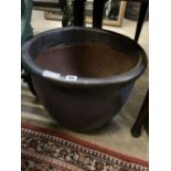 A circular glazed garden planter, height 37cm