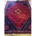 A North West Persian red ground rug, 250 x 180cm