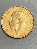 A George V 1913 gold sovereign, GVF.