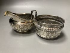 A George III embossed silver cream jug, Emes & Barnard, London, 1812 and a later silver sugar