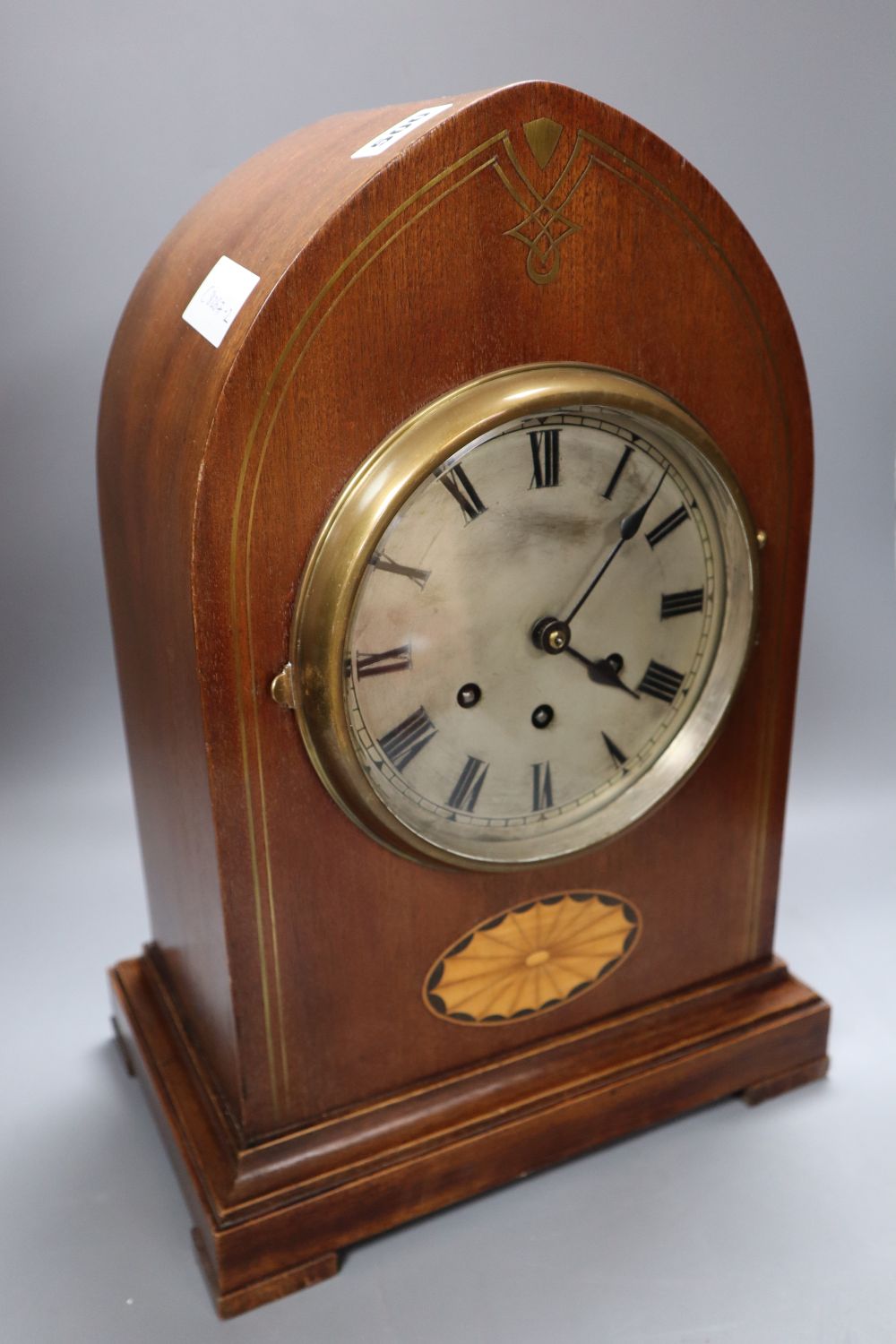 A Victorian mahogany and cut brass chiming lancet mantel clock, 6 inch silvered dial and French