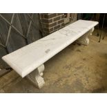 An early 20th century Italian carved white marble bench, with later marble top, width 182cm depth