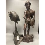 A large Japanese bronze 'bird' koro, 48cm and a large Indonesian hardwood figure of a fisherman,