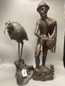 A large Japanese bronze 'bird' koro, 48cm and a large Indonesian hardwood figure of a fisherman,