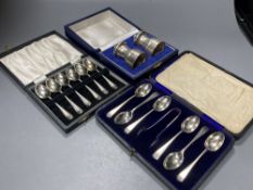 A cased pair of modern silver salt and pepper mills, 74mm and two cased sets of six silver coffee