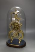 A 19th century brass skeleton clock, with fusee and in-line train, under glass dome, with key and