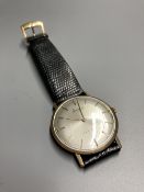 A gentleman's 9ct gold Accurist shockmaster manual wind wrist watch, on associated strap, gross 21.5