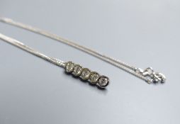 A modern 18ct white gold and five stone diamond set line pendant, 17mm, on an 18ct white gold fine