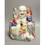 A large Chinese famille rose figure of Budai and children, mid 20th century, height 28cmCONDITION: