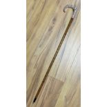 A modern 1980's silver mounting wooden walking cane, the handle decorated with hunting hound and