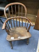 A 19th century elm and fruitwood child's Windsor elbow chair, width 40cm depth 30cm height 64cm