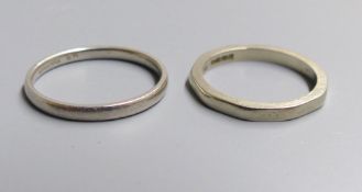 An 18ct gold decagonal wedding band (worn), size K, 2.9 grams and a white metal wedding band stamped